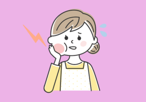 頬が腫れている人